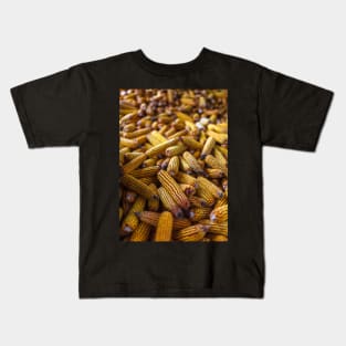 Yellow corn cobs in a barn Kids T-Shirt